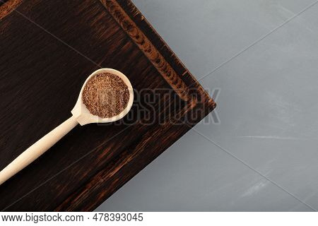 Pomace Milk Thistle In Wooden Spoon, Top View. Silybum Marianum Extract, Press Cake. Strong Antioxid