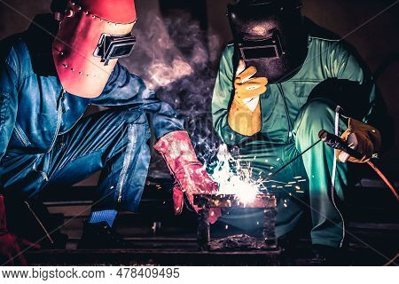 Metal Welding Steel Works Using Electric Arc Welding Machine To Weld Steel At Factory. Metalwork Man