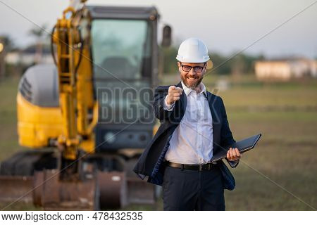 Construction Business Owner. Man In Suit And Hardhat Halmet At Building Construction Site. Civil Eng