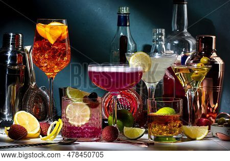 Alcoholic Cocktails Set, Strong Drinks And Aperitifs, Bar Tools, Bottles On Dark Green Background, H