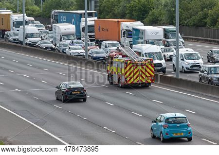 London, Uk - June 14, 2023: Fire Engine Travelling On Busy British Motorway M25