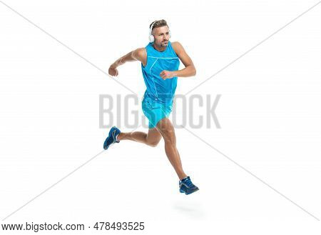 The Jogger Stretched Body Before Running. Sport Jogger Listen To Music In Headphones. The Jogger Ran