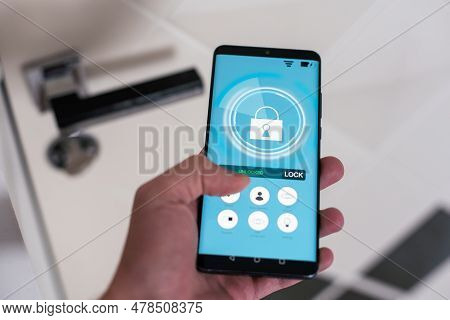 Smart House, Home Automation, Device With App Icons. Man Uses His Smartphone With Smarthome Security