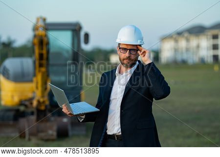Construction Business Owner. Man In Suit And Hardhat Halmet At Building Construction Site. Civil Eng