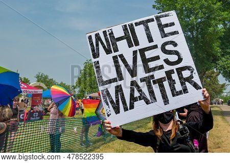 Unidentified  Masked Protestor Hollding White Lives Matter Banner At Hudson Pride.