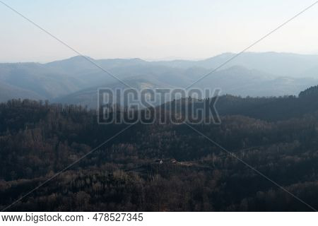 Landscape With Village House Surrounded With Forest Against Mountain In Haze, Mountain Ljubic Near P