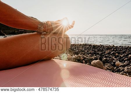 Woman Sea Yoga. Happy Woman In White Swimsuit And Boho Style Braclets Practicing Outdoors On Yoga Ma