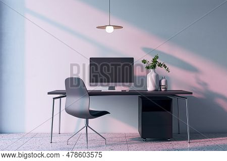 Modern Home Office Interior With Computer, Furniture And Other Items. Concrete Wall With Shadows In 