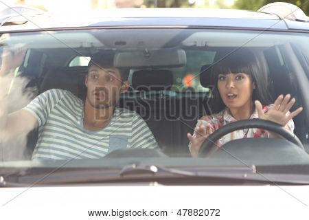 Scared woman shouts driving the car