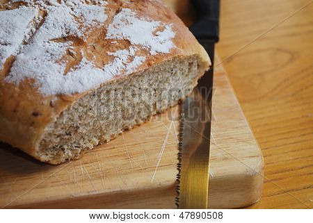Sourdough On Chopping Board With Knife