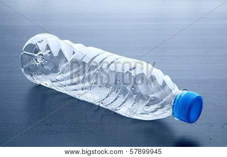 Empty Plastic Bottle Lying On Gray Background