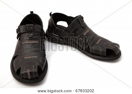 Black sandals on white