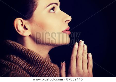 Believing woman praying to God