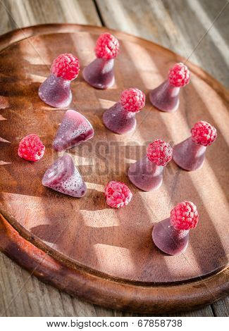 Cuberdons With Fresh Raspberries On The Wooden Board