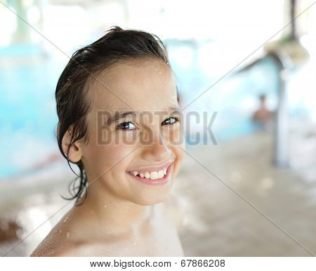 Happy little boys enjoying relaxing and splashing in water