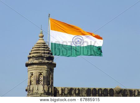 Indian flag flying over Gateway of India