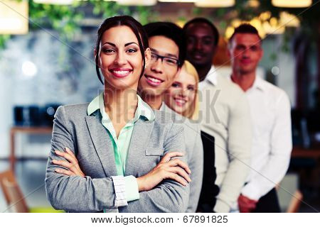 Happy group of business people in the office lined up