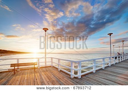 Beautiful retro pier at sunset over Baltic sea. Gdansk Brzezno, Poland
