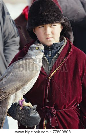Nura, Kazakhstan - February 23: Eagle On Kid's Hand In Nura Near Almaty On February 23, 2013 In Nura