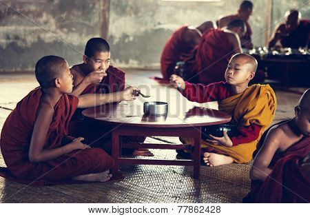 NYAUNGSHWE, MYANMAR - FEB 2: Young buddhist monk has the scanty dinner in Shwe Yan Pyay monastry, Inle Lake on February 2, 2011 in Nyaungswe, Myanmar.