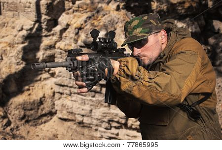 Portrait of the soldier with an automatic assault rifle