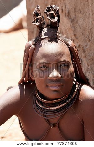 Himba Woman With Ornaments On The Neck In The Village