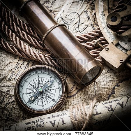 vintage  still life with compass,sextant spyglass and old map.map of the 1570. Author: Abraham Ortelius (1527-1598) 