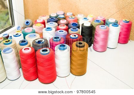 Many Spools Of Thread Is On The Table