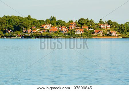 Red Cabins By The Water