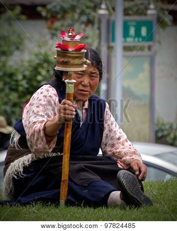 Tibetan Woman with Prayer Wheel