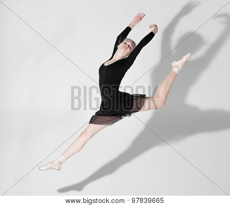 Jumping Ballerina With Beautiful Shapely Shadow