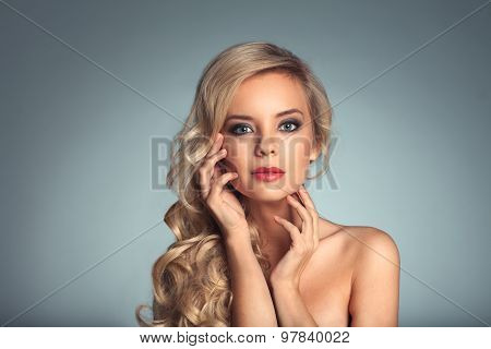 Portrait Of A Beautiful Woman On A Plain Background