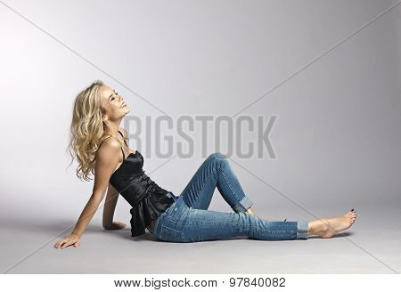 Beautiful Woman On A Gray Background