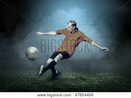 Soccer player with ball in action outdoors