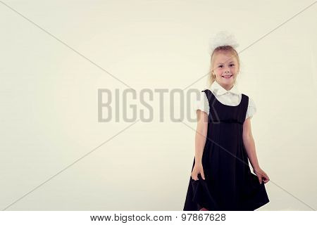 Cheerful school girl standing