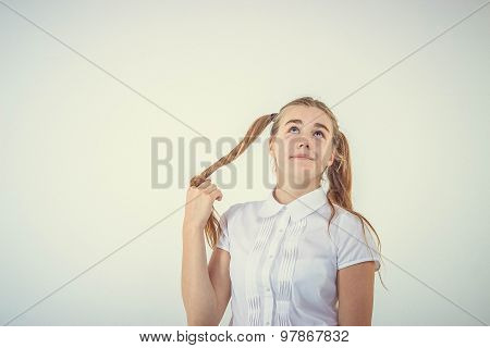 Schoolgirl thinking isolated on white background