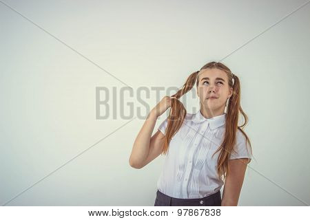 Schoolgirl thinking isolated on white background