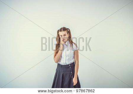 Schoolgirl thinking isolated on white background