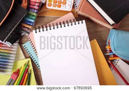 Busy Student's Desk With Blank Sketch Pad
