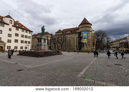 STUTTGART GERMANY - MARCH 01 2017: Schillerplatz - square in the old city named in honor of the German poet Friedrich Schiller. In the background Alte Kanzlei (The Old Chancellery) and the Old Castle.