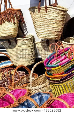 Shopping for colorful straw bags and wicker woven baskets