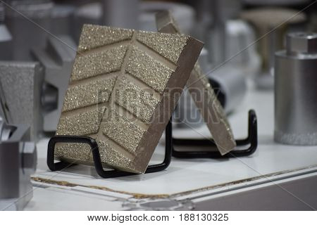 exposed samples of grindstone, on the metal rack