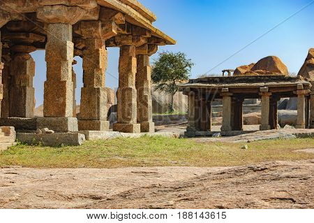 View of ancient ruins on Hemakuta hill in Hampi, Karnataka, India. Landscape with unique mountain formation with amazing stones tropical nature and temple. UNESCO World Heritage Site