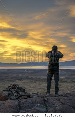 Man Taking Photos At Sunset. Patagonia, Argentina