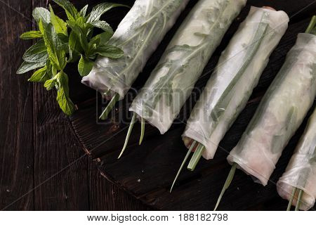 Delicious vietnamese spring roll with vegetable on dark background , healthy food