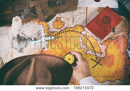 Explorer looking for a map with a treasure on an island
