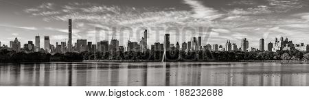 Morning panoramic view of Midtown Manhattan skyscrapers and the Central Park Reservoir in Black & White. New York City