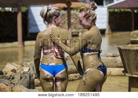 Young girls take mud baths to improve the condition of the skin and strengthen the immune system
