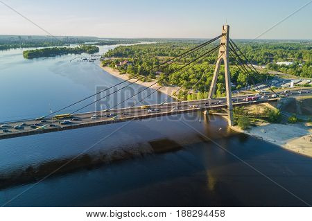 Aerial top view of Dnieper river and Moskovskiy bridge in city of Kiev, Ukraine