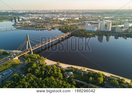 Aerial top view of Dnieper river and Moskovskiy bridge in city of Kiev, Ukraine